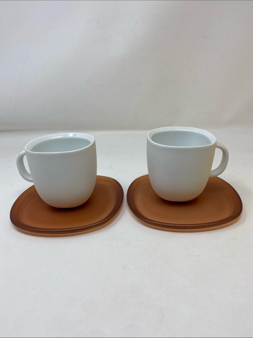 Federica Biasi Nespresso White Ceramic Coffee Cups & Translucent Brown Saucers